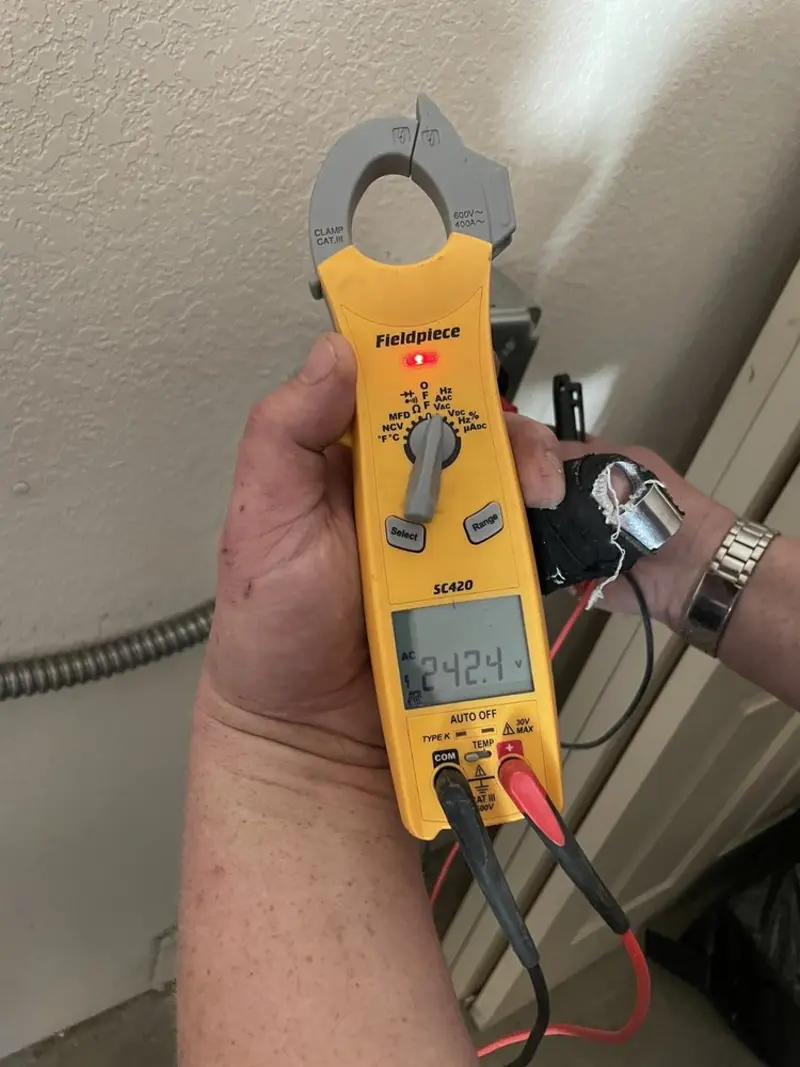 Voltage testing with clamp meter during Outlet Installation in Sky Lake